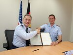 U.S. Air Force Maj. Gen. Clinton Crosier (left), U.S. Strategic Command (USSTRATCOM) director of plans and policy, and German Luftwaffe (air force) Brig. Gen. Burkhart Pototzky, department head and head of the Luftwaffe Operations Center, meet for the signing of a memorandum of agreement (MoA) in Uedem, Germany, June 1, 2017. The MoA authorizes, for the first time, the assignment of a German liaison officer to USSTRATCOM’s Joint Functional Component Command for Space under the Multinational Space Collaboration (MSC) effort. The MSC will explore mutual capabilities and identify opportunities for greater integration by co-locating additional allies and partners with U.S. space operators. One of nine Department of Defense unified combatant commands, USSTRATCOM has global strategic missions assigned through the Unified Command Plan that include strategic deterrence, space operations, cyberspace operations, joint electronic warfare, global strike, missile defense, intelligence, and analysis and targeting.