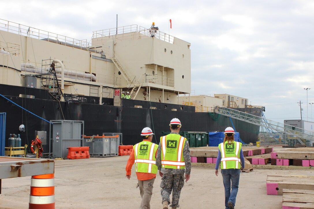 Program Manager Hans Honerlah, Baltimore District’s Radiological Health Physics Regional Center of Expertise; Baltimore District Commander Col. Ed. Chamberlayne; and Baltimore District Project Manager Brenda Barber, project manager for the ongoing STURGIS decommissioning work in Galveston, walk on the pier alongside the vessel during a site visit on Dec. 8, 2015.

The U.S. Army Corps of Engineers, Baltimore District, working closely with the Corps’ Galveston District, is managing the decommissioning and dismantling of the STURGIS, a former World War II Liberty Ship that was converted into the first floating nuclear power plant in the 1960s.
