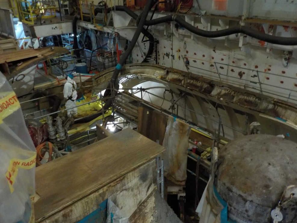 Crews work to access the Reactor Containment Vessel in order to remove various large components, including the Reactor Pressure Vessel, from the STURGIS as part of ongoing decommissioning efforts.