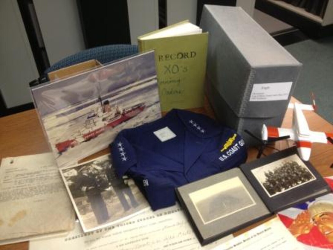 Mixed donation to the Coast Guard Heritage Asset Collection and Archives including uniform, scrapbook, photographs, documents, logbooks, etc.  Coast Guard Museum, Academy, New London, CT.