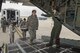Capt. Laurie Ann Quiry, 914th Aeromedical Evacuation Squadron, directs members of the 914th Aeromedical Staging Squadron as they load “patients” onto a C-130 aircraft as part of a joint service training exercise involving members from other branches of the military. Participants carry out simulated emergency scenarios to gain skills and experience that can be applied to real world situations. (U.S. Air Force photo by Tech. Sgt. Stephanie Sawyer)