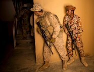 RABKUT, Oman (Feb. 26, 2017) U.S. Marine Lance Cpl. Christopher Aquino-Williams, an infantryman with Company A, Battalion Landing Team 1st Bn., 4th Marines, 11th Marine Expeditionary Unit (MEU), peeks behind a corner before leading soldiers with the Royal Army of Oman (RAO) into a building while conducting Military Operations on Urban Terrain (MOUT) training as part of Exercise Sea Soldier ‘17 at Rabkut, Oman, Feb. 26. During the training, Marines coached the Omani soldiers and supervised each team execute room clearing techniques. Sea Soldier 2017 is an annual, bilateral exercise conducted with the Royal Army of Oman designed to demonstrate the cooperative skill and will of U.S. and partner nations to work together in maintaining regional stability and security. The 11th MEU is deployed in the U.S. 5th Fleet area of operations in support of maritime security operations designed to reassure allies and partners, preserve the freedom of navigation and the free flow of commerce and enhance regional stability. (U.S. Marine Corps photo by Cpl. April L. Price)