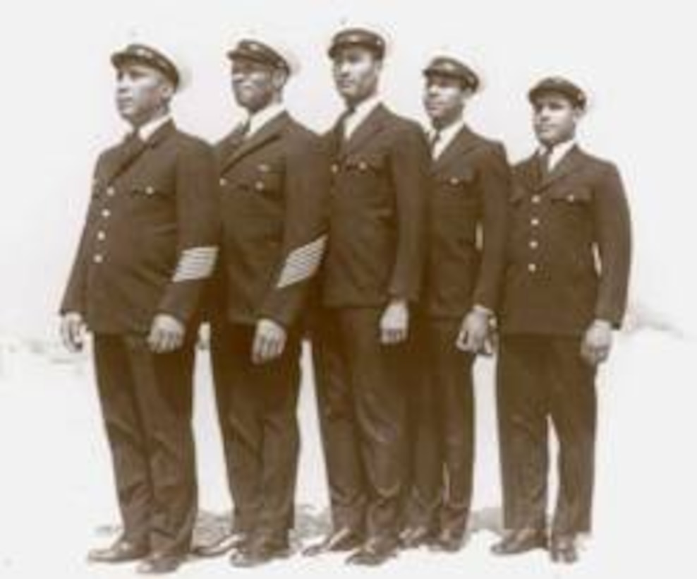 Left to Right: BM1/c Maxie Berry; Surfman Lonnie C. Gray; Surfman Ruben Gallop; unidentified (Surfman Fleetwood M. Dunston?); Surfman Herbert M. Collins.
No photo number/date; probably 1942.

Coast Guard Archives