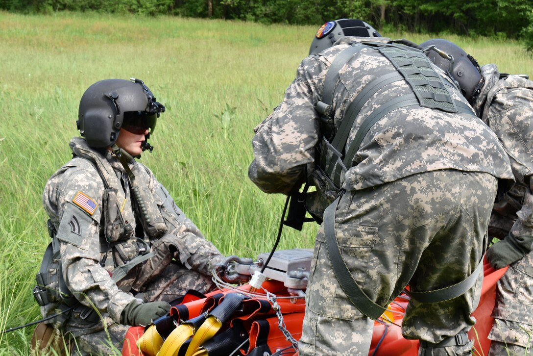 New York Army National Guardsmen pack a bucket firefighting system after completing training near Round Lake, N.Y., May 31, 2017. Army National Guard photo by Pfc. Andrew Valenza