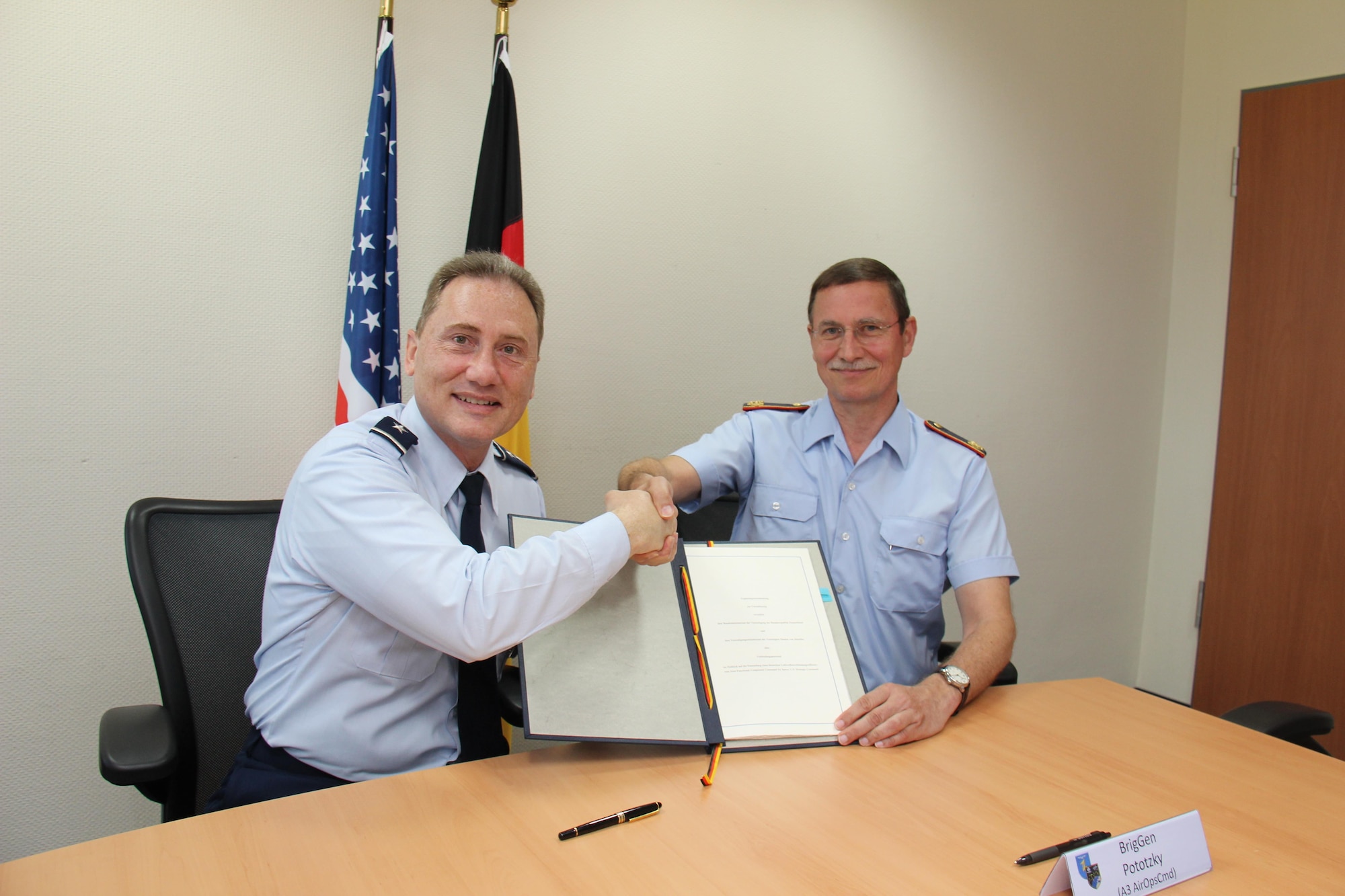 U.S. Air Force Maj. Gen. Clinton Crosier (left), the U.S. Strategic Command (USSTRATCOM) director of plans and policy, and German Luftwaffe (air force) Brig. Gen. Burkhart Prototzky, the department head and head of the Luftwaffe Operations Center, meet for the signing of a memorandum of agreement in Uedem, Germany, June 1, 2017. The MoA authorizes, for the first time, the assignment of a German liaison officer to USSTRATCOM’s Joint Functional Component Command for Space under the Multinational Space Collaboration  effort. The MSC will explore mutual capabilities and identify opportunities for greater integration by colocating additional allies and partners with U.S. space operators. 