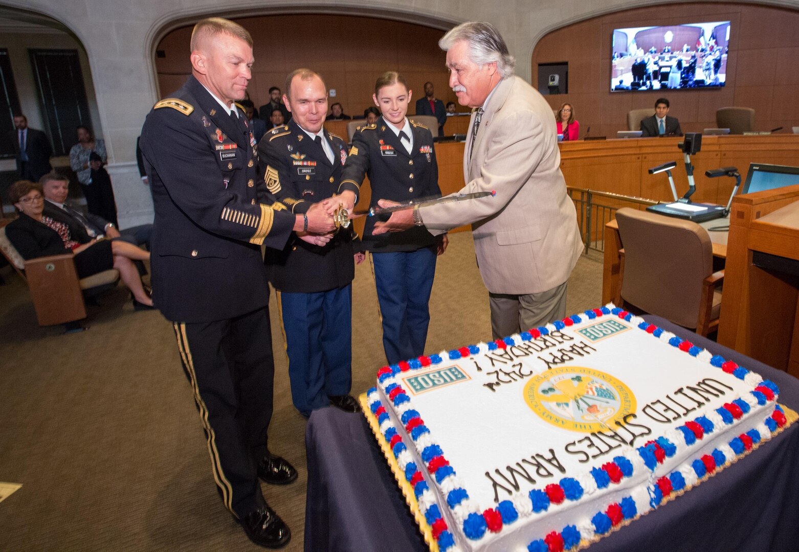 (From left) Lt. Gen. Jeffrey S. Buchanan, commander of U.S. Army North (Fifth Army), Command Sgt. Maj. Ronald Orosz, ARNORTH senior enlisted advisor, along with the youngest and oldest Army representatives prepare to cut the Army birthday cake at City Hall in San Antonio June 1. The oldest Soldier was represented by Ray Lopez (far right), city councilman for District Six, who served in the Army for 16 years. The youngest Soldier was represented by Sgt. Catherine Trisch (second fro. right), an ARNORTH geospatial engineer with just over three years of service. 