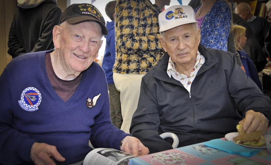 1st Lt. John “Des” Howarth and Maj. Rafael “Raf” Ramos, 36th Bombardment Squadron veterans, pose for a photo during a Royal Air Force 100 Group Association Reunion luncheon May 13, 2017 at the City of Norwich Aviation Museum, England. Ramos and Howarth provided early, electronic warfare support to bomber aircraft during World War II. (Courtesy Photo)