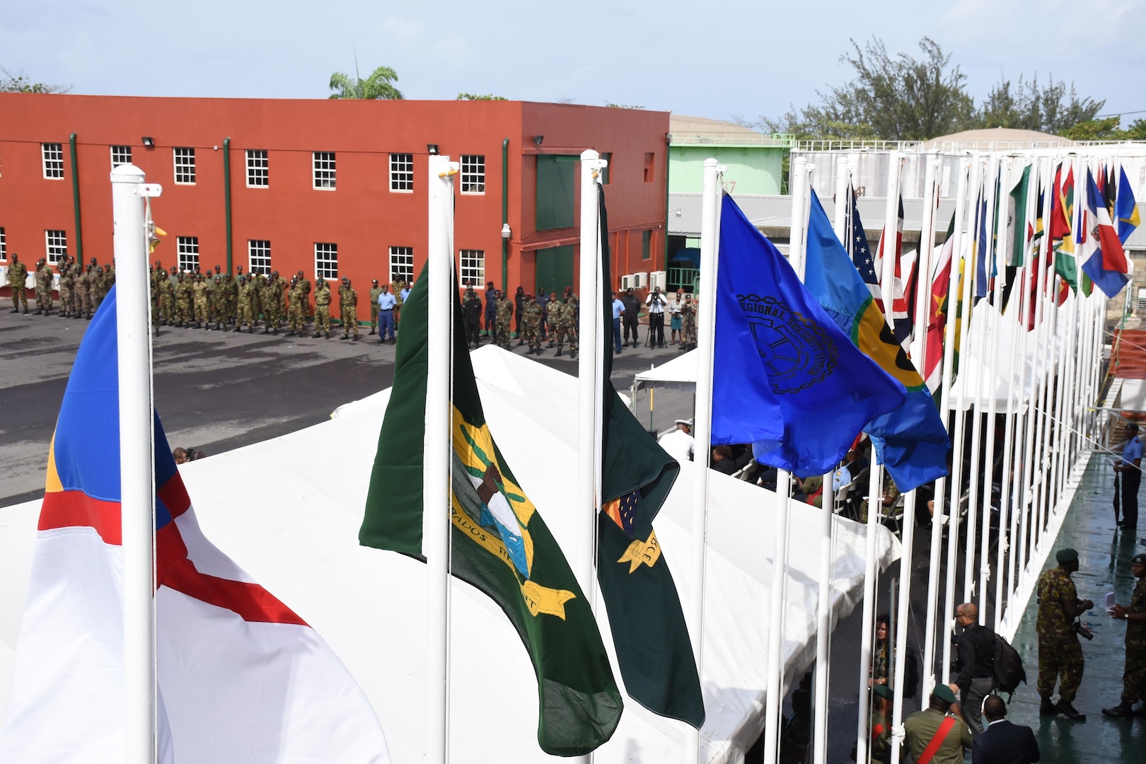 Different countries' flags are shown during the opening ceremony for Tradewinds 2017 in Bridgetown, Barbados, June 6, 2017.  Tradewinds is a joint, combined exercise conducted in conjunction with partner nations to enhance the collective abilities of defense forces and constabularies to counter transnational organized crime, and to conduct humanitarian/disaster relief operations. (U.S. Coast Guard photo by Petty Officer 1st Class Melissa Leake/Released)