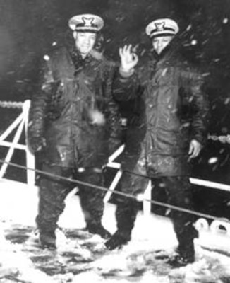Pioneer African American officers Joseph
Jenkins and Clarence Samuels during a
snowstorm on the deck of USS Sea Cloud, a
Coast Guard-manned vessel and the nation’s
first integrated U.S. sea service ship. 
Coast Guard Archives
