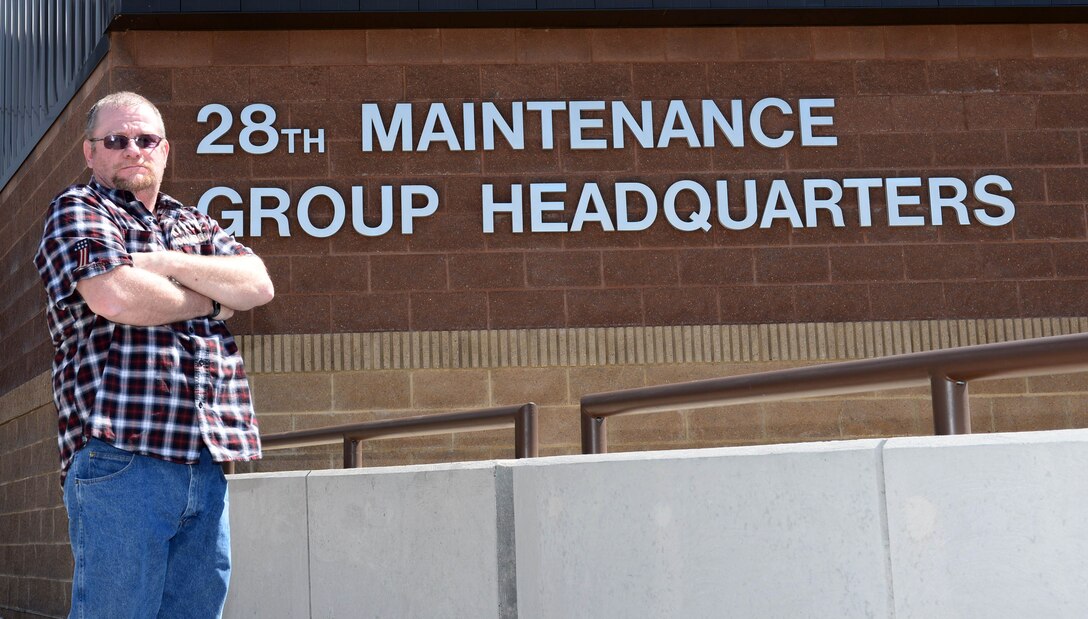 Gregory Carter, the Air Force Repair Enhancement Program manager assigned to the 28th Maintenance Group, stands in front of the 28th MXG Head Quarters at Ellsworth Air Force Base, S.D., March 31, 2017. As the AFREP Program manager, Carter has help the 28th Bomb Wing save more than $34 million over the past decade he has spent with the group. (U.S. Air Force photo by Airman 1st Class Donald C. Knechtel)