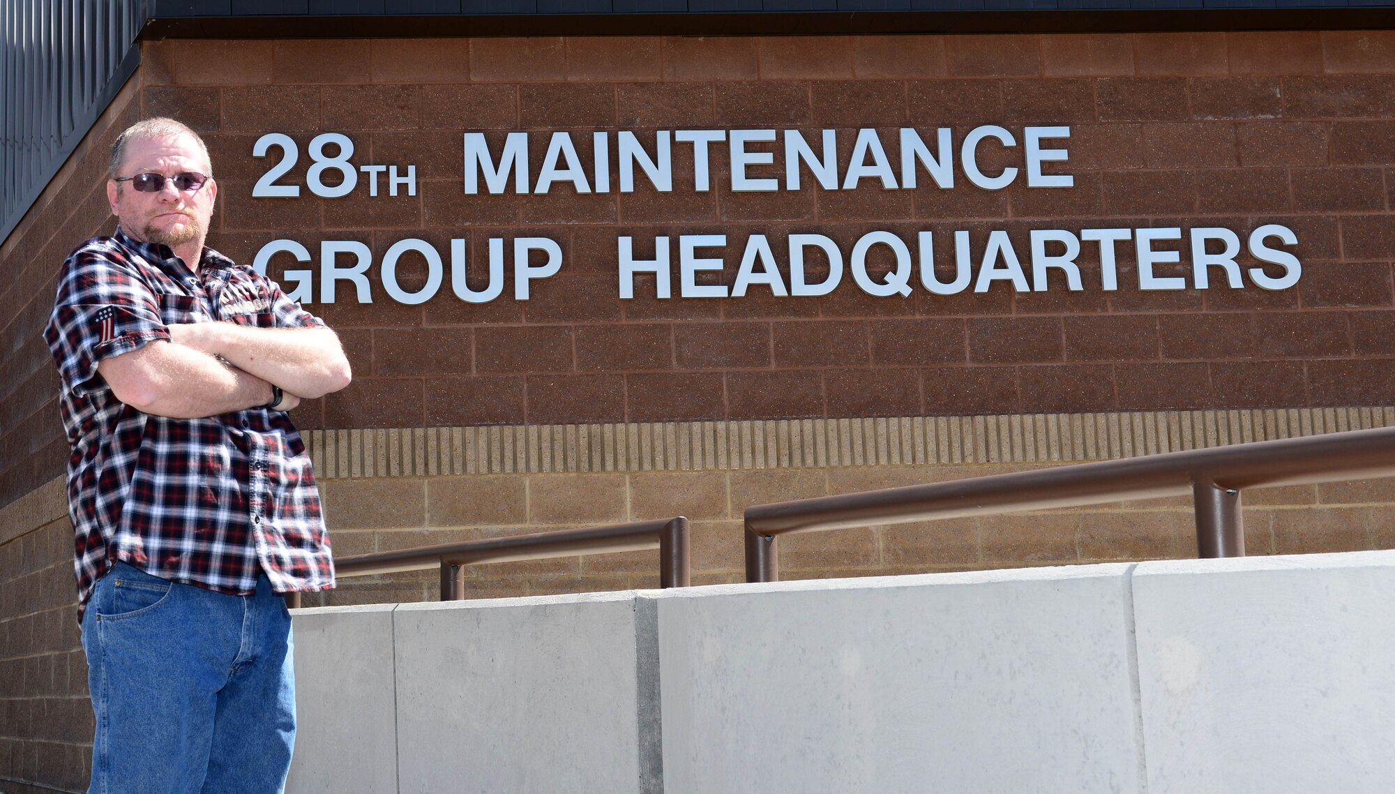 Gregory Carter, the Air Force Repair Enhancement Program manager assigned to the 28th Maintenance Group, stands in front of the 28th MXG Head Quarters at Ellsworth Air Force Base, S.D., March 31, 2017. As the AFREP Program manager, Carter has help the 28th Bomb Wing save more than $34 million over the past decade he has spent with the group. (U.S. Air Force photo by Airman 1st Class Donald C. Knechtel)