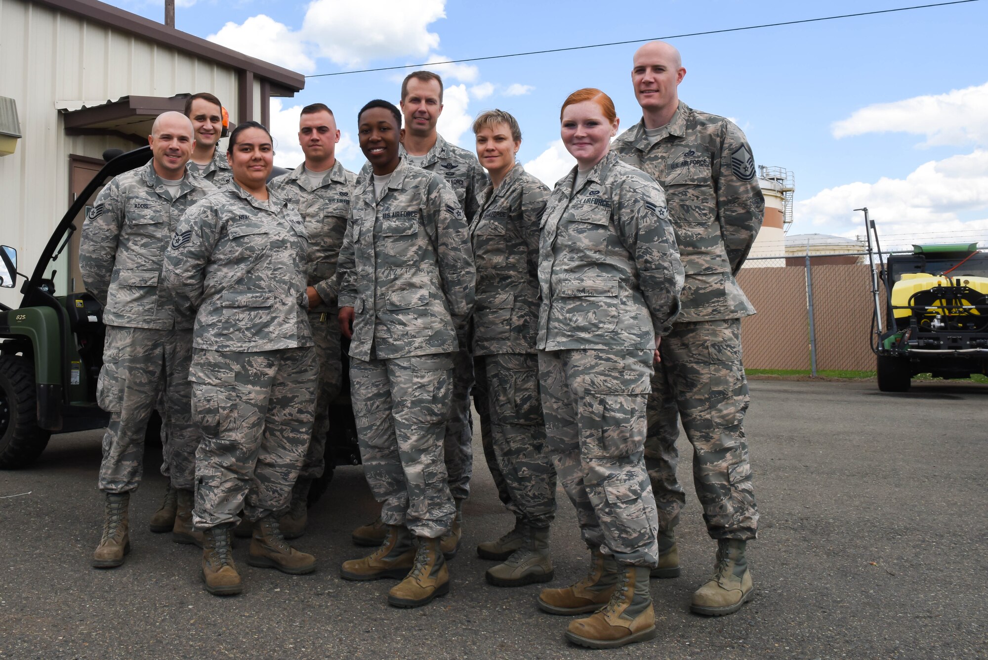 The 2nd Civil Engineer Squadron Pest Management office poses for a group photo with Col. Ty Neuman, 2nd Bomb Wing commander and Chief Master Sgt. Theresa Clapper, command chief, on Barksdale Air Force Base, La., May 24, 2017. Pest management catches feral dogs and wild hogs on base. (U.S. Air Force photo/Airman 1st Class Sydney Bennett)