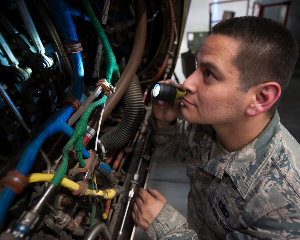 U.S. Air Force Staff Sgt.  Eleno G. Silva, 317th Maintenance Squadron aerospace maintenance craftsman, checks the wiring inside a C-130 J Hercules at Dyess Air Force Base, Texas. Silva strives to ensure every task is done efficiently and correctly. (U.S. Air Force photo by Airman Kylee Thomas)