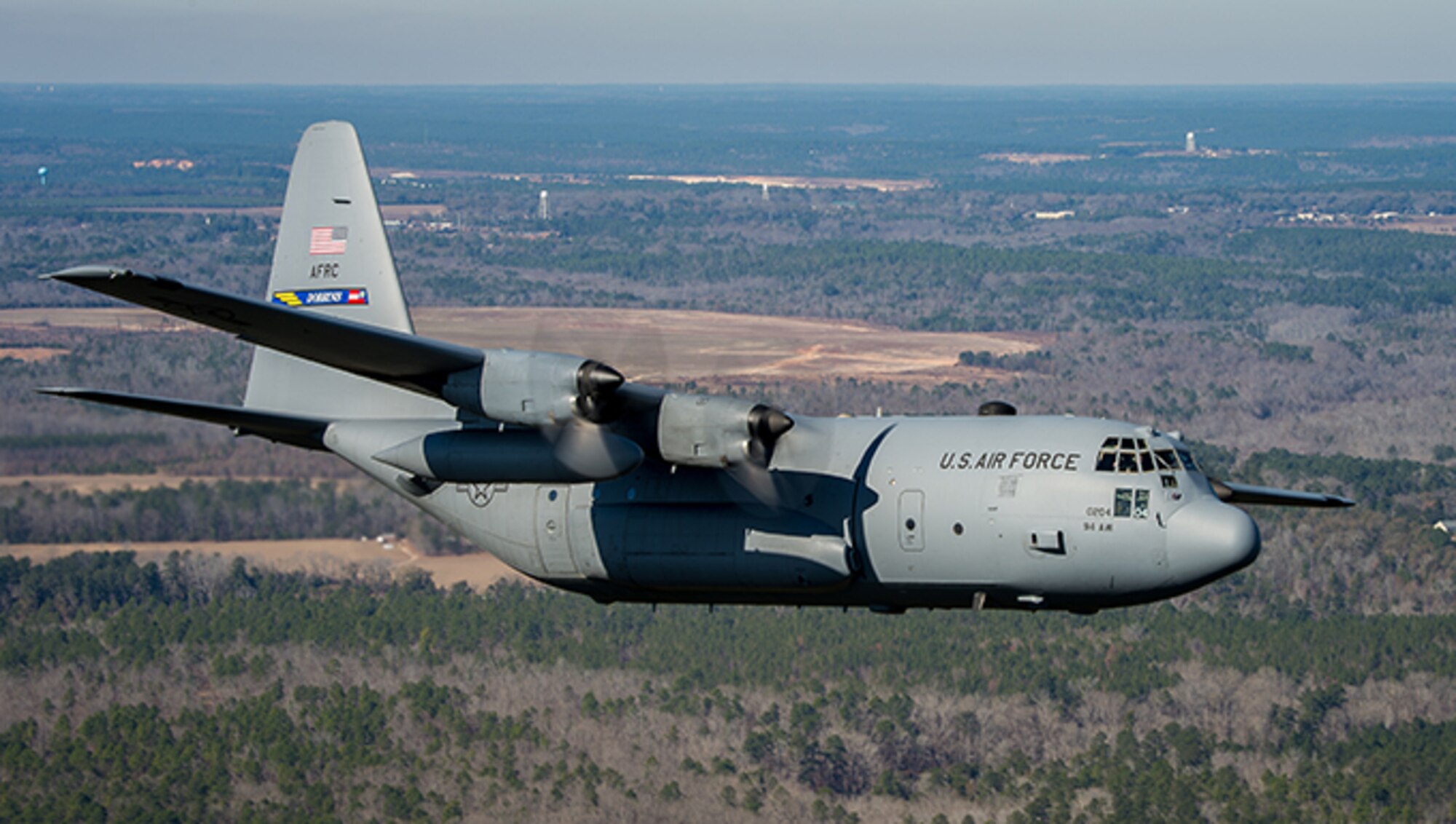 A 94th Airlift Wing C-130 Hercules cruises over North Georgia during a training exercise at Dobbins Air reserve Base, Georgia Dec. 19, 2013. (Photo by Tony Granata)