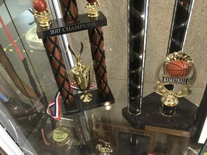 Trophies and a medal won by the Joint Base Langley-Eustis, Men’s Varsity basketball team, the “Raptors,” is displayed in the Shellbank Fitness Center at Joint Base Langley-Eustis, Va., June 6, 2017. The Raptors finished the season with eight regular season wins, two third place wins and one first place tournament finish. (Courtesy Photo)