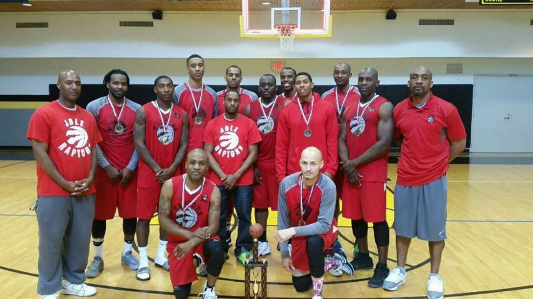 The Joint Base Langley-Eustis, Men’s Varsity Basketball Team, the “Raptors,” pose for a group photo after winning the Washington Area Military Athletic Conference tournament, at Fort Myer, Va., April 2, 2017. The Raptors defeated, last year’s champions from Fort Lee and became the 2017 WAMAC champions. (Courtesy Photo)