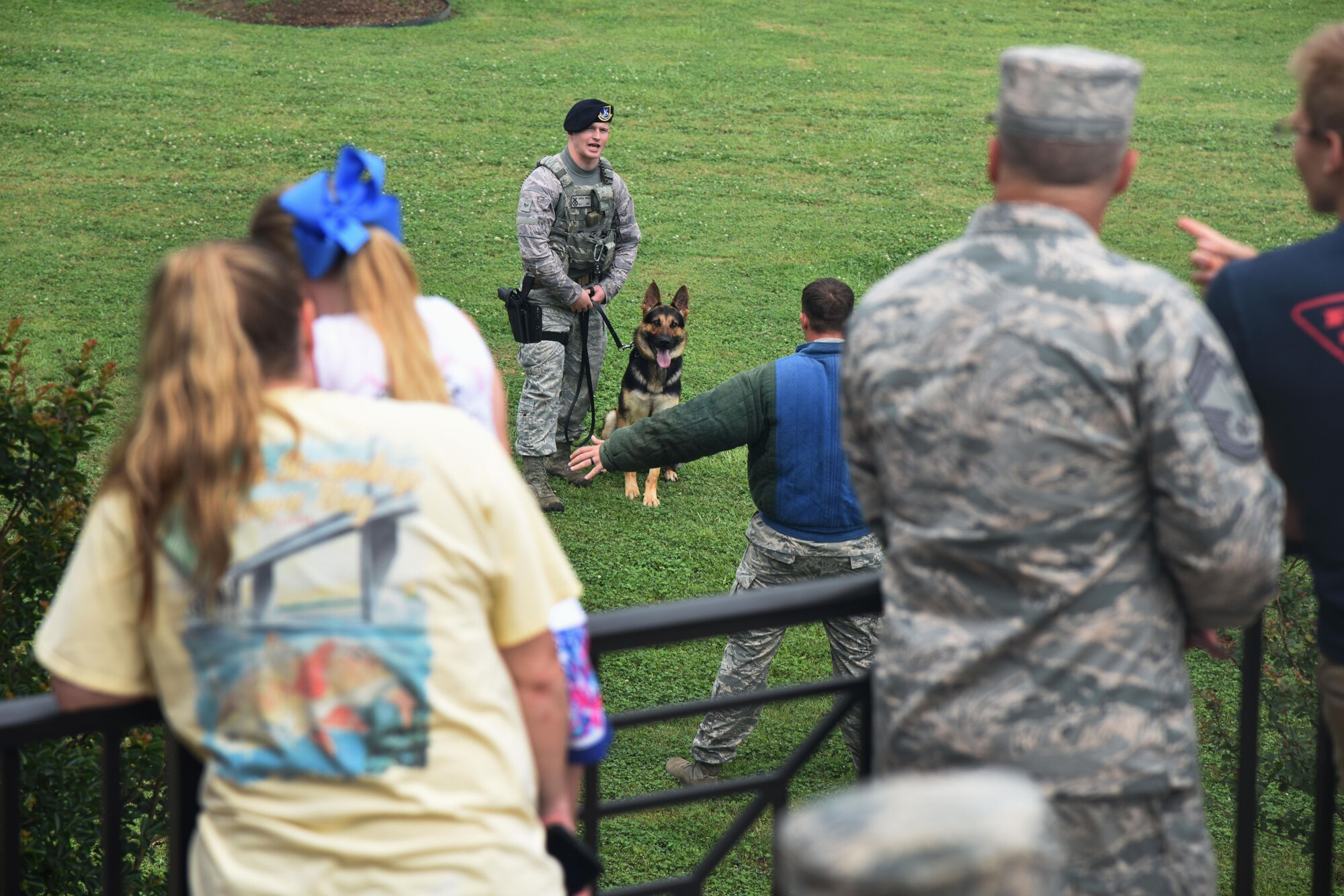 Senior Airman Andrew McCloy, 81st Security Forces Squadron military working dog handler, and his military working dog, Gamma, provide a demonstration during the Keesler Summer Bash at the Bay Breeze Event Center June 1, 2017, on Keesler Air Force Base, Miss. The bash also consisted of a demonstration by the 338th Training Squadron drill team, games and free food. (U.S. Air Force photo by Kemberly Groue)