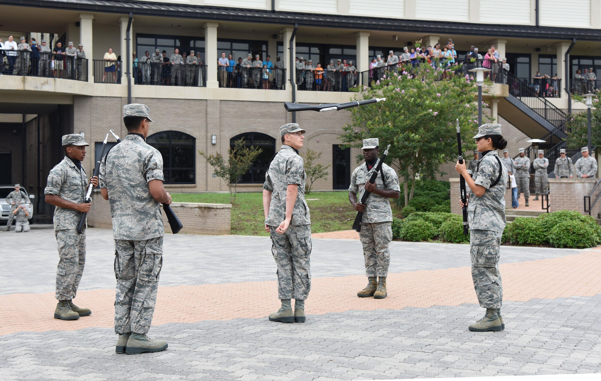 Members of the 338th Training Squadron drill team provide a demonstration during the Keesler Summer Bash at the Bay Breeze Event Center June 1, 2017, on Keesler Air Force Base, Miss. The bash also consisted of a demonstration by the 81st Security Forces Squadron military working dogs, games and free food. (U.S. Air Force photo by Kemberly Groue)