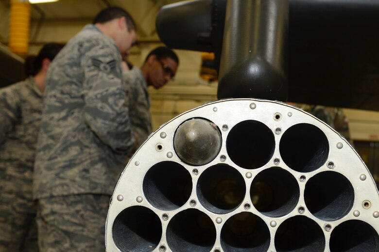 U.S. Air Force Airmen assigned to the 633rd Force Support Squadron learn about the weapon systems unit on an AH-64 Apache helicopter during a tour of the 128th Aviation Brigade at Joint Base Langley-Eustis, Va. June 2, 2017. Along with firing simulated rounds, the Airmen learned about the different types of explosive used on Apache helicopters. (U.S. Air Force photo/Airman 1st Class Kaylee Dubois)