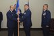 U.S. Air Force Maj. Min Lee, the new 17th Security Forces Squadron Commander, takes the guideon from Col. Christopher Harris, 17th Mission Support Group Commander, at the Event Center on Goodfellow Air Force Base, Texas, June 5, 2017. The event symbolizes the change of the 17 SFS commanders. (U.S. Air Force photo by Airman 1st Class Chase Sousa/Released)