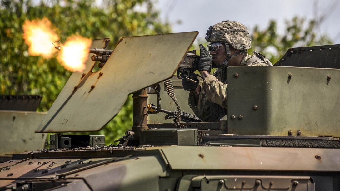 A soldier fires blank rounds at mock opposing forces during a combat search and rescue training exercise with fellow soldiers, airmen and sailors at Andersen Air Force Base, Guam, June 5, 2017. The soldier is assigned to Task Force Talon, 94th Army Air and Missile Defense Command. Air Force photo by Staff Sgt. Joshua Smoot