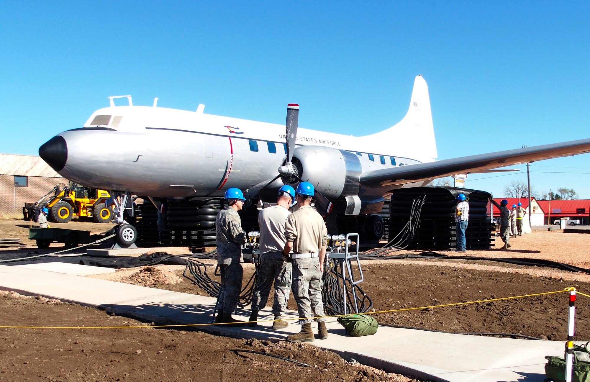 Airmen assigned to the 28th Civil Engineer Squadron assist with remodeling the South Dakota Air and Space Museum exterior in Box Elder, S.D., Nov. 1, 2015. Airmen laid gravel, installed sidewalks and placed xeriscape plants to increase the efficiency and accessibility of the museum. (Courtesy photo)