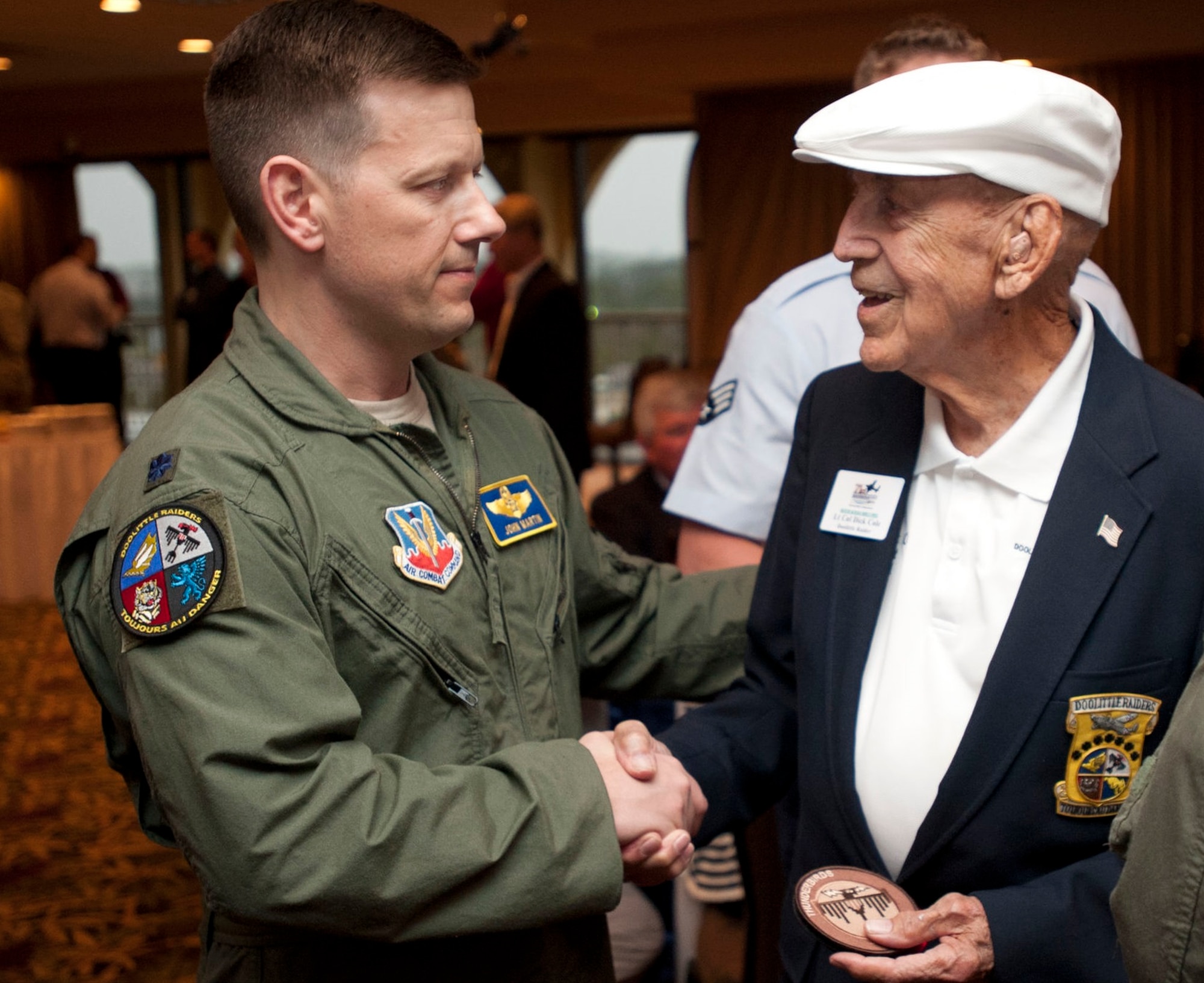 Then Lt. Col. John Martin, commander of the 28th Operations Group, talks with retired Lt. Col. Dick Cole, one of the original Doolittle Raiders during a special event at Fort Walton Beach, Florida, April 19, 2013. Reflecting on the 100th anniversary of two of the original squadrons that participated in the historic raid - the 34th Bomb Squadron and 37th Bomb Squadron - Martin noted the Doolittle Raid is the cornerstones of our bomberheritage. (U.S. Air Force Photo by Senior Airman Carlin Leslie)