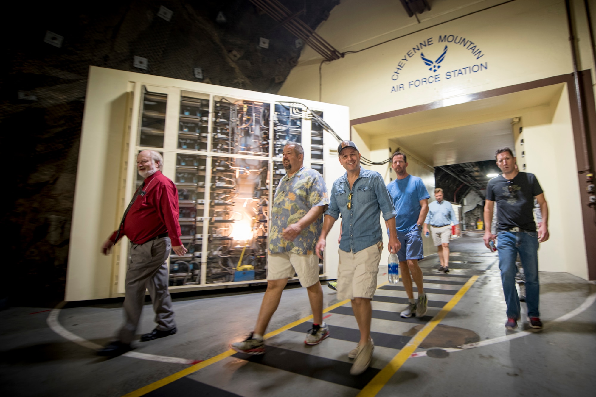 CHEYENNE MOUNTAIN AIR FORCE STATION, Colo. – Steve Lemme, actor and comedian, walks through the blast doors at Cheyenne Mountain Air Force Station, Colo., June 2, 2017. Lemme is a graduate of Cheyenne Mountain High School in Colorado Springs and flew in for a high school reunion. (U.S. Air Force photo by Senior Airman Dennis Hoffman)