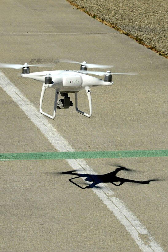 A small unmanned aerial system performs a roof inspection on Building 1401 near the Edwards flightline as part of a series of tests to determine its feasibility as an inspection tool for the 412th Civil Engineer Group. The tests were also flown to evaluate the performance of the aircraft’s systems. (U.S. Air Force photo by Christopher Ball)