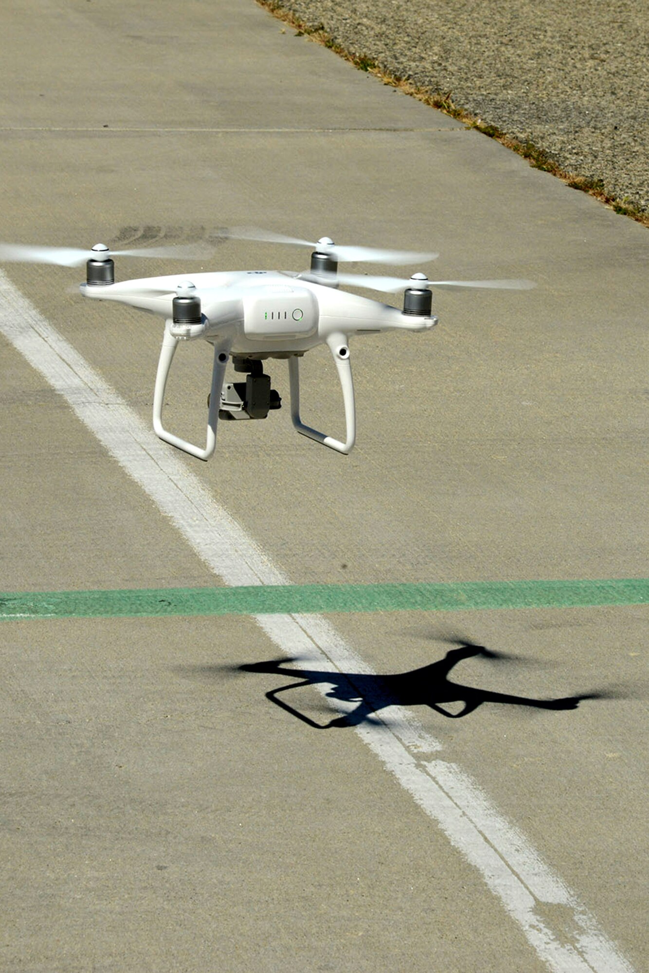 A small unmanned aerial system performs a roof inspection on Building 1401 near the Edwards flightline as part of a series of tests to determine its feasibility as an inspection tool for the 412th Civil Engineer Group. The tests were also flown to evaluate the performance of the aircraft’s systems. (U.S. Air Force photo by Christopher Ball)