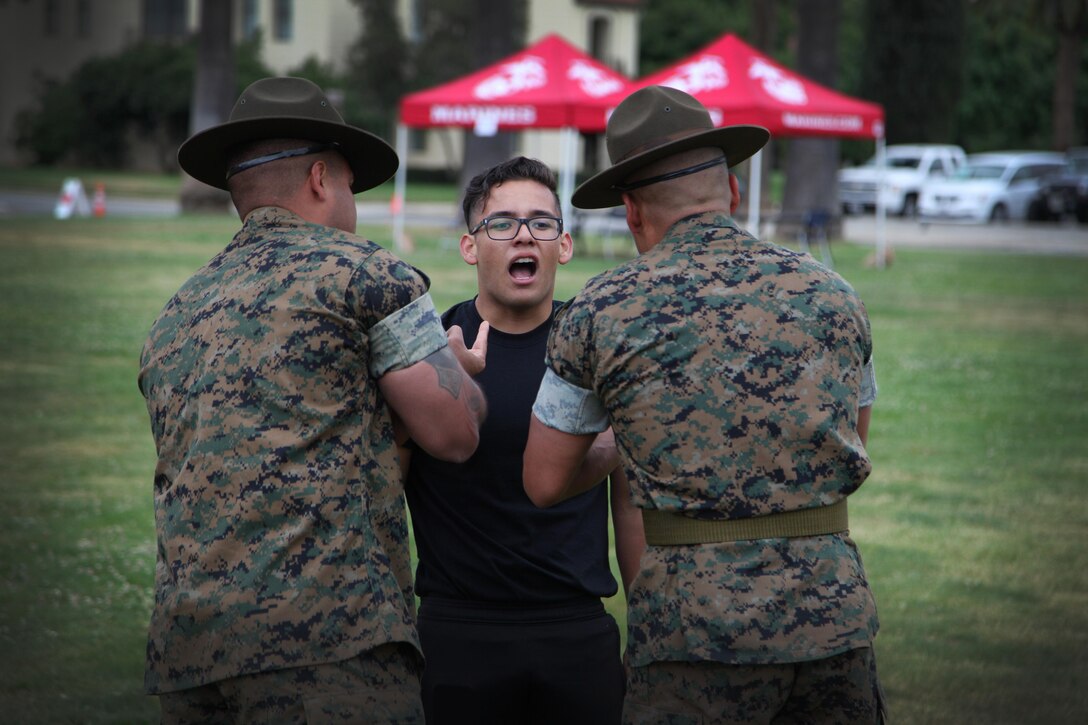 Drill Instructors incentivize a future Marine during the Annual Pool Function. 
