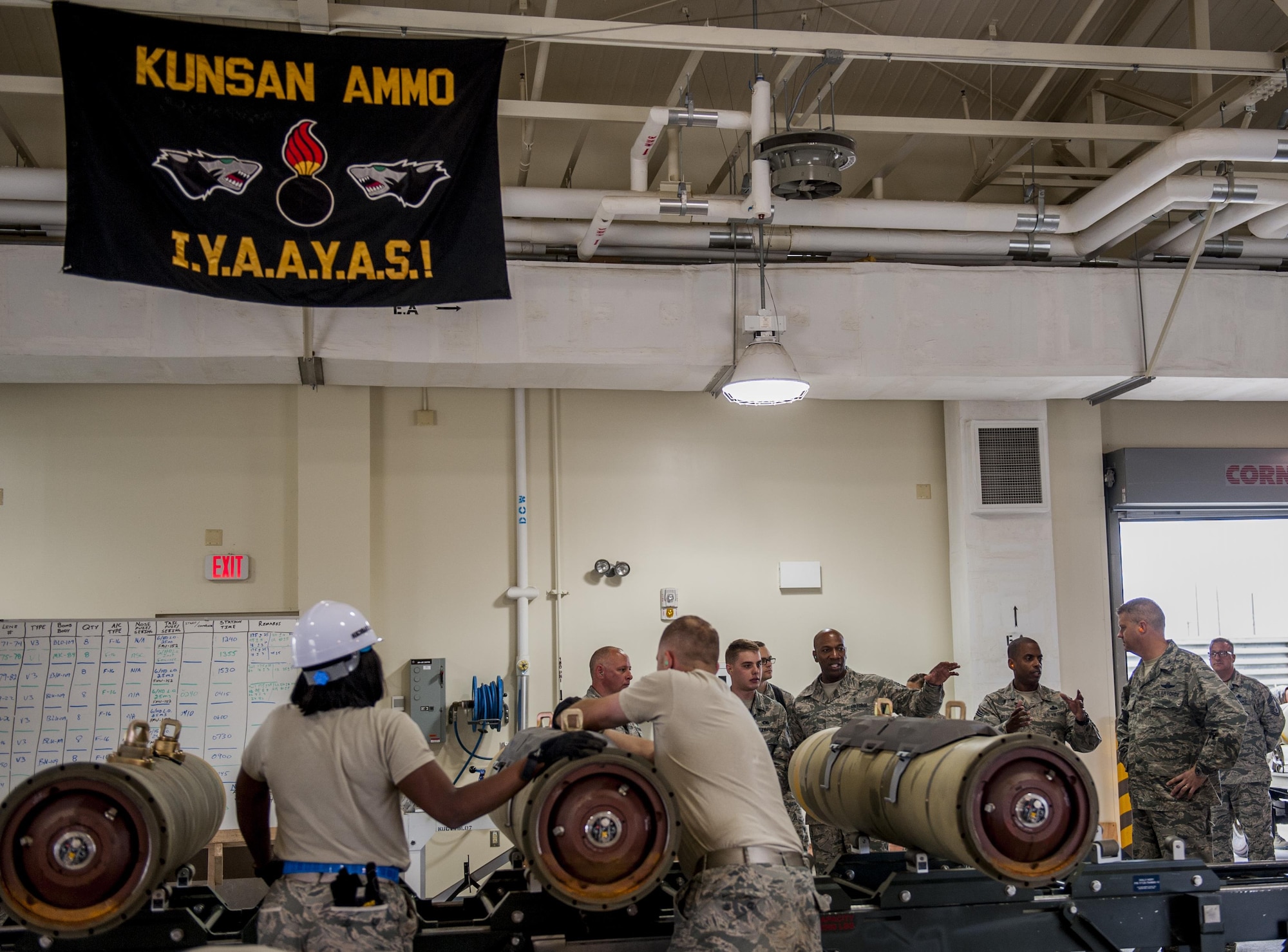 8th Maintenance Squadron conventional maintenance crew members assemble Guided Bomb Unit 31 version 3 during the Combat Ammunition Production Exercise, while Chief Master Sgt. of the Air Force Kaleth O. Wright observes as he takes a tour at Kunsan Air Base, Republic of Korea, June 6, 2017. CAPEX allowed Airmen to test their readiness, which is critical in the deterrence of aggression and defending the Republic of Korea. Approximately 350 Airmen from bases across PACAF as well as two Air National Guard units participated. (U.S. Air Force photo by Senior Airman Colville McFee/Released)