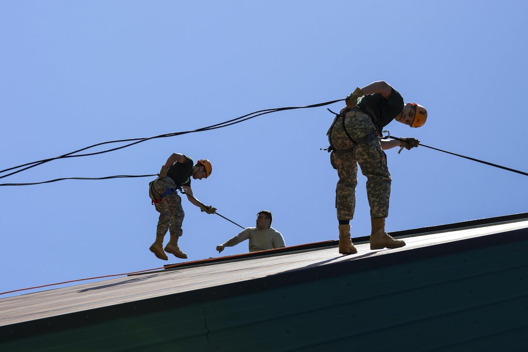 Alaska junior ROTC cadets rappel from a jump tower near Camp Carroll at Joint Base Elmendorf-Richardson, Alaska, May 30, 2017, during a summer leadership camp. Air Force photo by Airman 1st Class Javier Alvarez