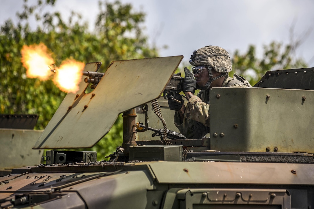 A soldier fires blank rounds at mock opposing forces during a combat search and rescue training exercise with fellow soldiers, airmen and sailors at Andersen Air Force Base, Guam, June 5, 2017. The soldier is assigned to Task Force Talon, 94th Army Air and Missile Defense Command. Air Force photo by Staff Sgt. Joshua Smoot