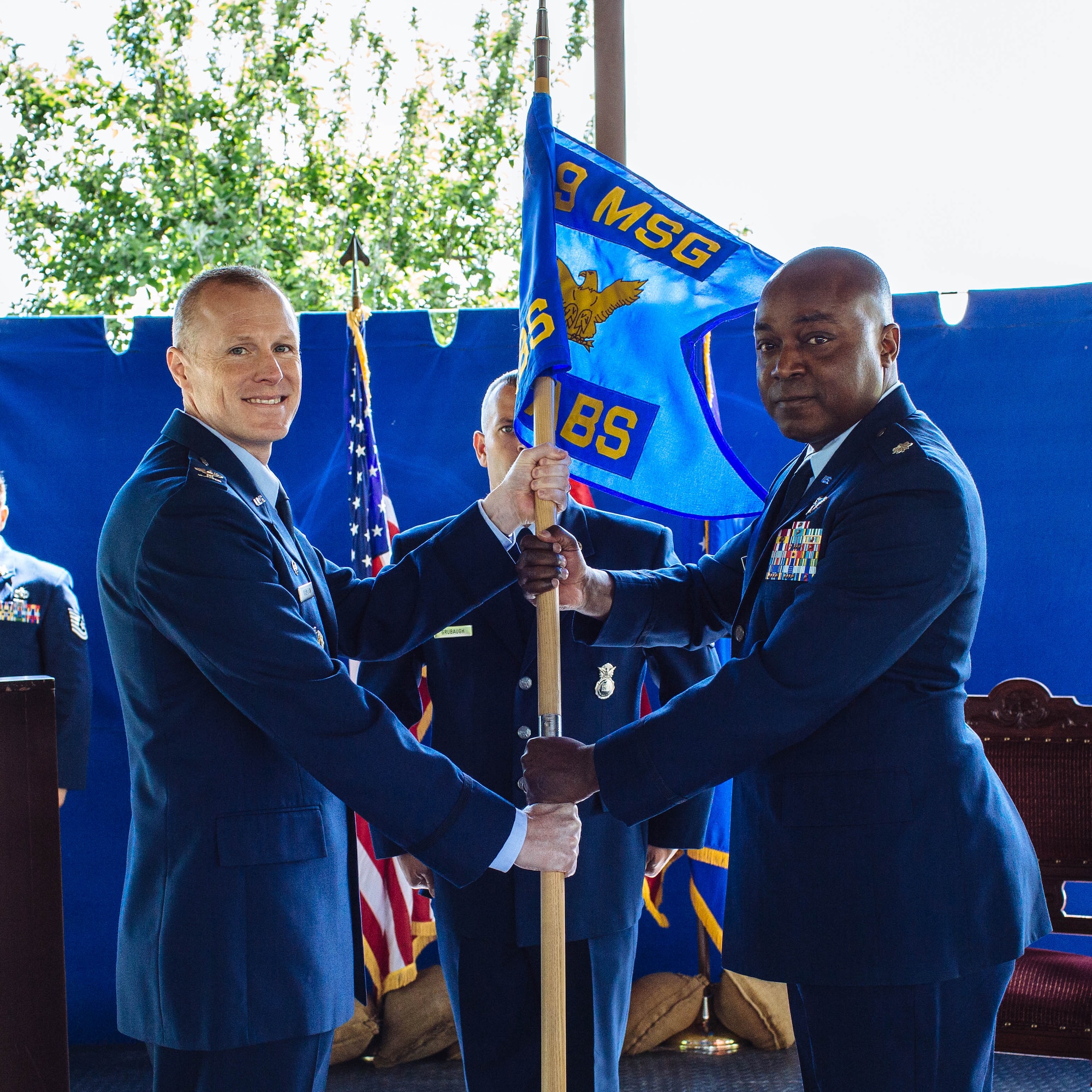 Col. Todd Stratton, 39th Air Base Wing Mission Support Group commander (left), presents the guidon to Lt. Col. Christopher Floyd , 717th Air Base Squadron commander (right), during the 717th ABS change of command ceremony May 16, 2017, at the Ankara Support Facility, Turkey. A change of command ceremony is a tradition that represents a formal transfer of authority and responsibility from the outgoing commander to the incoming commander. (U.S. Air Force courtesy photo)