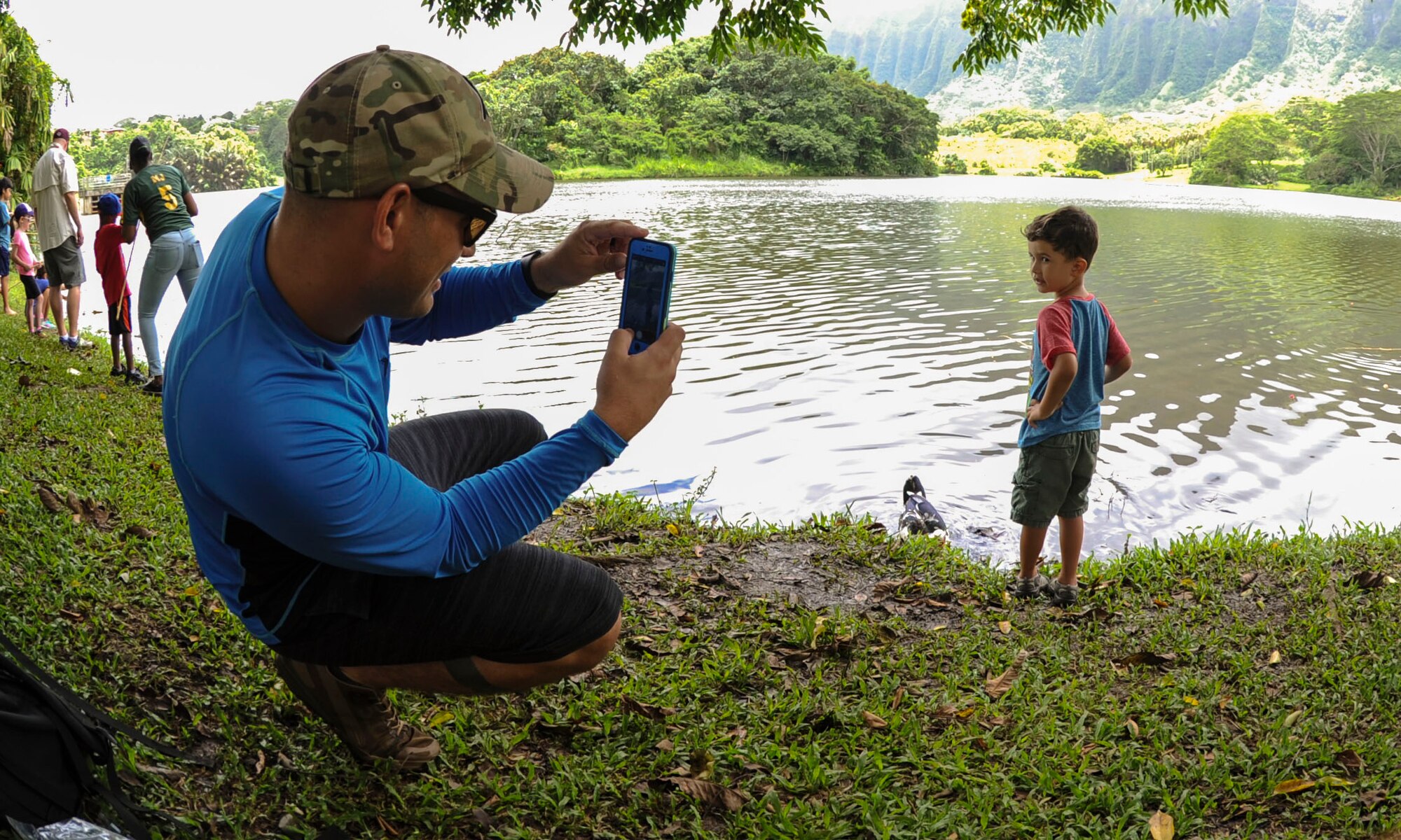 Jonah Nelson poses for father, Master Sgt. Zach Nelson, 747 Communications Squadron radio frequency transmission section chief, during the 18th Annual Friends of Hickam Keiki Fishing Tournament in Kaneohe, Hawaii, May 31, 2017.  The tournament is a long-standing tradition that unites the Airmen of the 15th Wing with the Friends of Hickam to build stronger relationships between the base and the community. (U.S. Air Force photo by Tech. Sgt. Heather Redman)