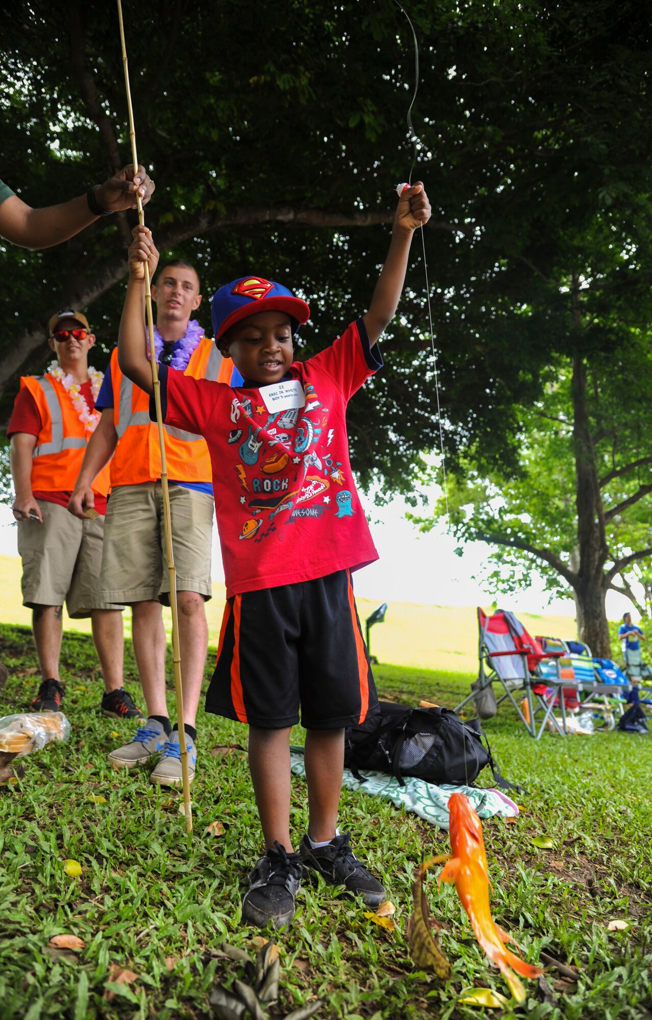 Eric Jr. White pulls up his first fish during the 18th Annual Friends of Hickam Keiki Fishing Tournament in Kaneohe, Hawaii, May 31, 2017.  The tournament is a long-standing tradition that unites the Airmen of the 15th Wing with the Friends of Hickam to build stronger relationships between the base and the community. (U.S. Air Force photo by Tech. Sgt. Heather Redman)