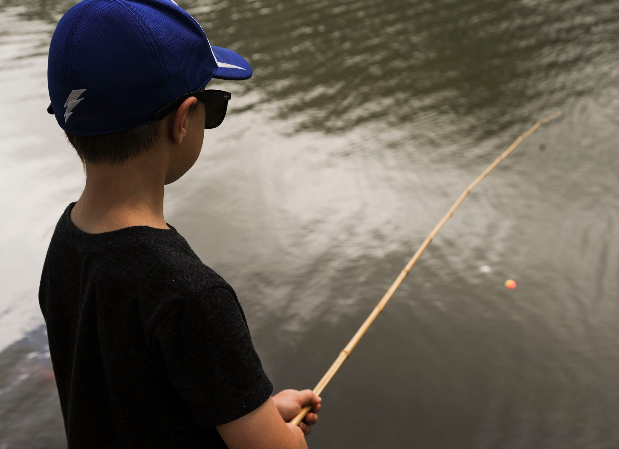 Emmett Baldwin casts his line during the 18th Annual Friends of Hickam Keiki Fishing Tournament in Kaneohe, Hawaii, May 31, 2017.  The tournament is a long-standing tradition that unites the Airmen of the 15th Wing with the Friends of Hickam to build stronger relationships between the base and the community. (U.S. Air Force photo by Tech. Sgt. Heather Redman)