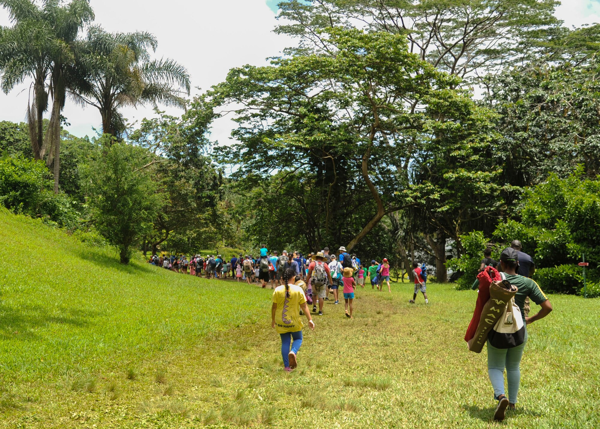 Families head down to the shore of Ho'omaluhia Botanical Gardens, for the 18th Annual Friends of Hickam Keiki Fishing Tournament in Kaneohe, Hawaii, May 31, 2017. The tournament is a long-standing tradition that unites the Airmen of the 15th Wing with the Friends of Hickam to build stronger relationships between the base and the community. (U.S. Air Force photo by Tech. Sgt. Heather Redman)