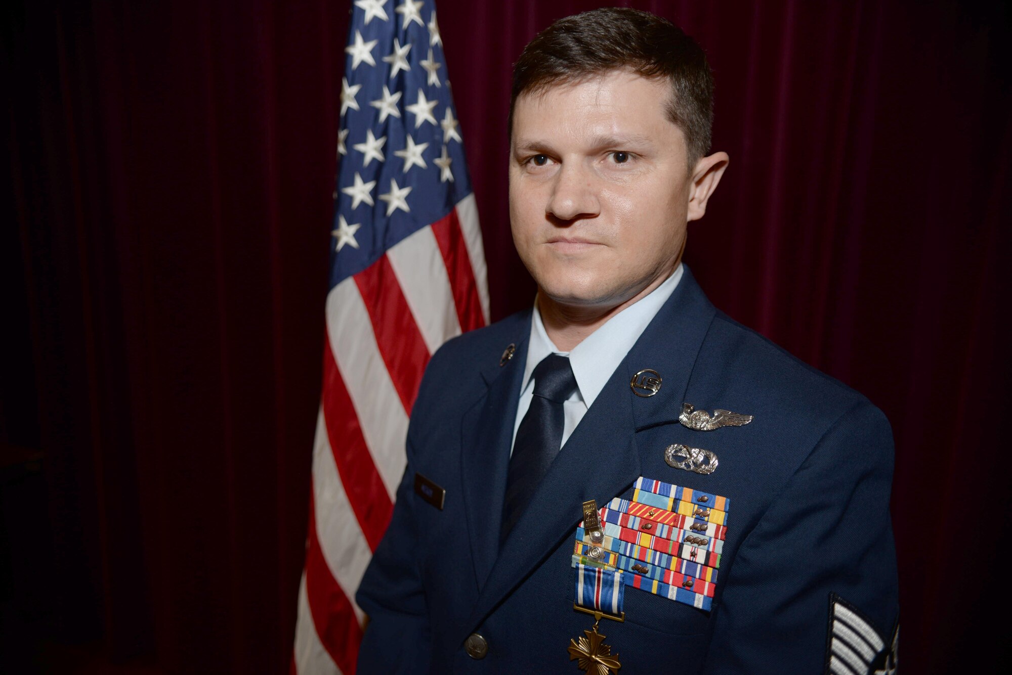 U.S. Air Force Tech. Sgt. James M. McKay, 7th Special Operations Squadron special missions’ aviator, poses for a photograph June 2, 2017, on RAF Mildenhall, England. The Distinguished Flying Cross medal hangs off the uniform of McKay, marking him as the 80th Airman in Air Force Special Operations Command to receive this honor, a medal created in 1918 to reward those who display heroism or extraordinary achievement while participating in an aerial flight. (U.S. Air Force photo by Airman 1st Class Tenley Long)