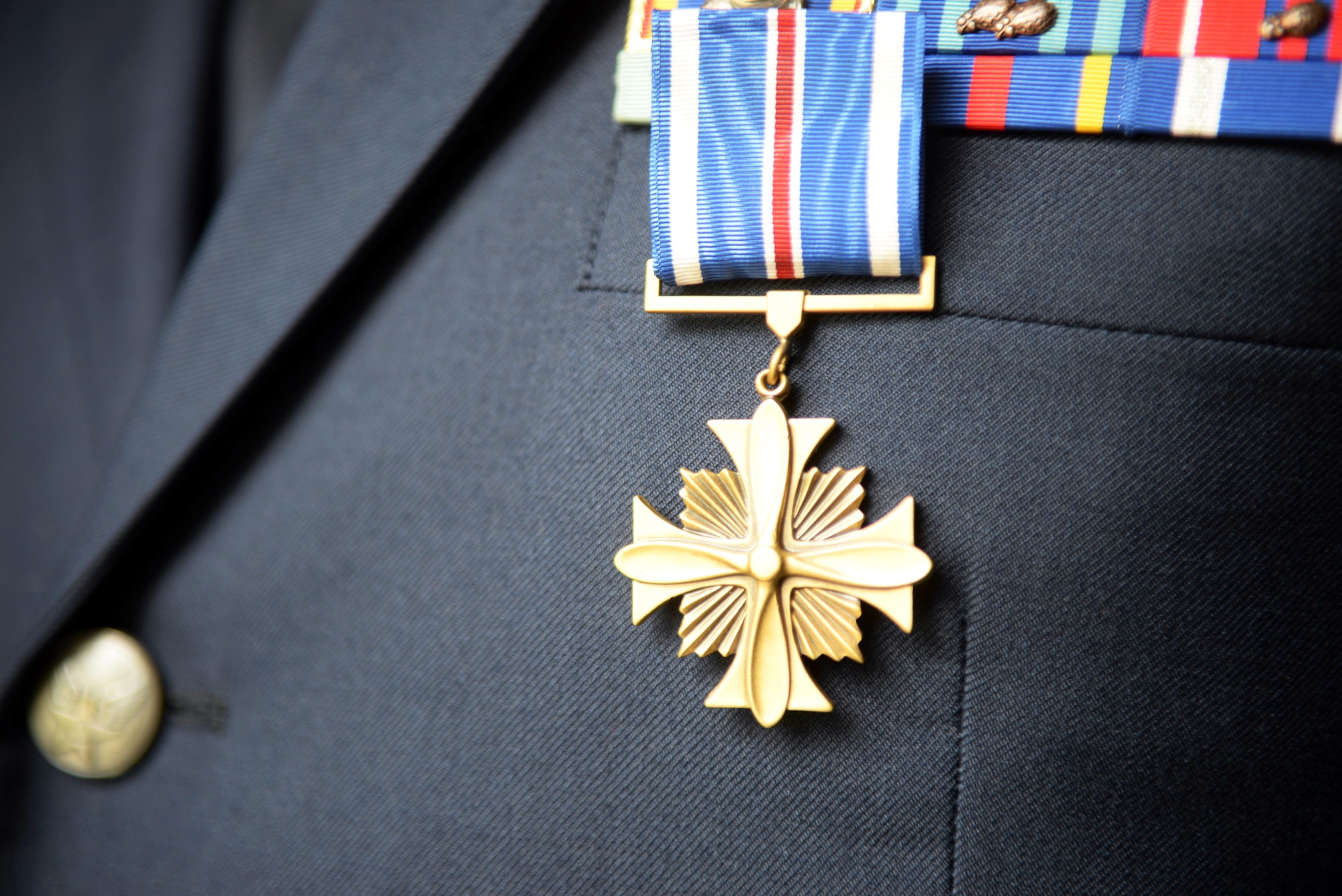 The Distinguished Flying Cross medal hangs off the uniform of U.S. Air Force Tech. Sgt. James M. McKay, 7th Special Operations Squadron special missions’ aviator, June 2, 2017, on RAF Mildenhall, England. McKay is the 80th Airman in Air Force Special Operations Command to receive this honor, a medal created in 1918 to reward those who display heroism or extraordinary achievement while participating in an aerial flight. (U.S. Air Force photo by Airman 1st Class Tenley Long)