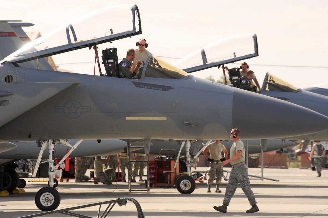 Oregon Air National Guardsmen prepare F-15 Eagle aircrafts for a mission at Nellis Air Force Base, Nev., May 31, 2017. The guardsmen are assigned to the 142nd Fighter Wing. The Oregon Airmen are playing the role of aggressors during their three week temporary duty assignment supporting the weapons inspector course. Air National Guard photo by Master Sgt. John Hughel