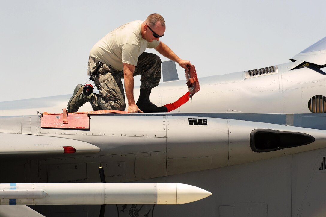 Air National Guard Tech. Sgt. Jacob Cox completes post flight operations on an F-15 Eagle at Nellis Air Force Base, Nev., June 1, 2017. The F-15 is assigned to the 142nd Fighter Wing. Air National Guard photo by Master Sgt. John Hughel