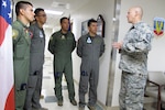 U.S. Air Force Master Sgt. Austin Blessard, Georgia Air National Guard 117th Air Control Squadron weapons and tactics non-commissioned officer in charge, introduces himself to members of the Colombian air force during a State Partnership Program Subject Matter Expert Exchange on Ground Control Intercept with the Georgia Air National Guard, May 30-June 2, 2017, at Hunter Army Airfield in Savannah, Georgia. 