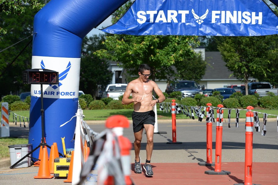 Second Lt. Forrest Schaffer, 14th Student Squadron Student Pilot, finishes the triathlon June 3, 2017, on Columbus AFB, Mississippi. The actual time of the athletes was calculated with ankle bracelets that were synced with electronic pads they passed over at the end and start of each event. (U.S. Air Force photo by Airman 1st Class Keith Holcomb)