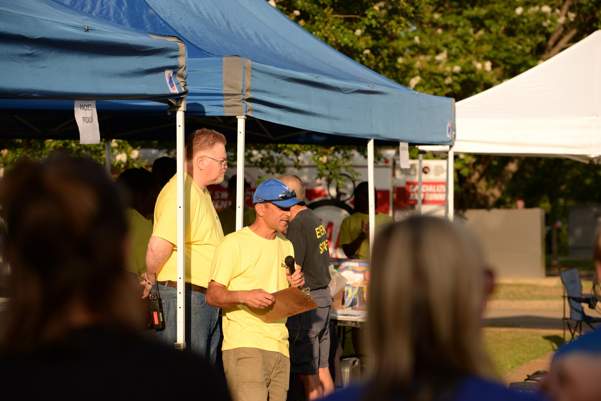 Col. Anthony Sansano, 14th Mission Support Group Commander, speaks to the crowd in the Columbus Club parking lot before a triathlon June 3, 2017, on Columbus Air Force Base, Mississippi. The event staff was in charge of keeping the event safe and had individuals at specific markers to hand water to the participants. (U.S. Air Force photo by Airman 1st Class Keith Holcomb)