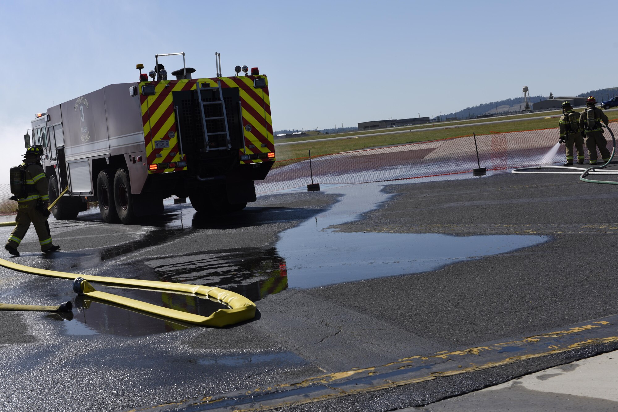 Fairchild fire fighters respond to a simulated airplane crash June 5, 2017, at Fairchild Air Force Base, Washington. Fairchild and local first responders participated in a Major Accident Response Exercise in preparation for Fairchild’s upcoming 2017 SkyFest Air Show. (U.S. Air Force Photo/Airman 1st Class Ryan Lackey)