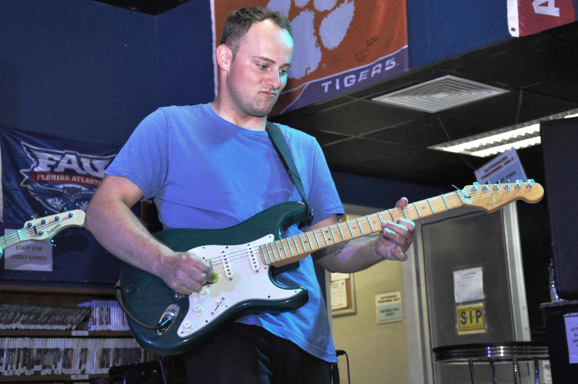Airman 1st Class Josiah Joyce, guitarist and equipment custodian for the AFCENT Band, jams out on the guitar during an extended solo during the band’s cover of “Freebird” by Lynyrd Skynyrd at the Starlifter Memorial Day concert Monday, May 29, 2017, at an undisclosed location in Southwest Asia. (U.S. Air Force photo/Master Sgt. Eric Sharman)