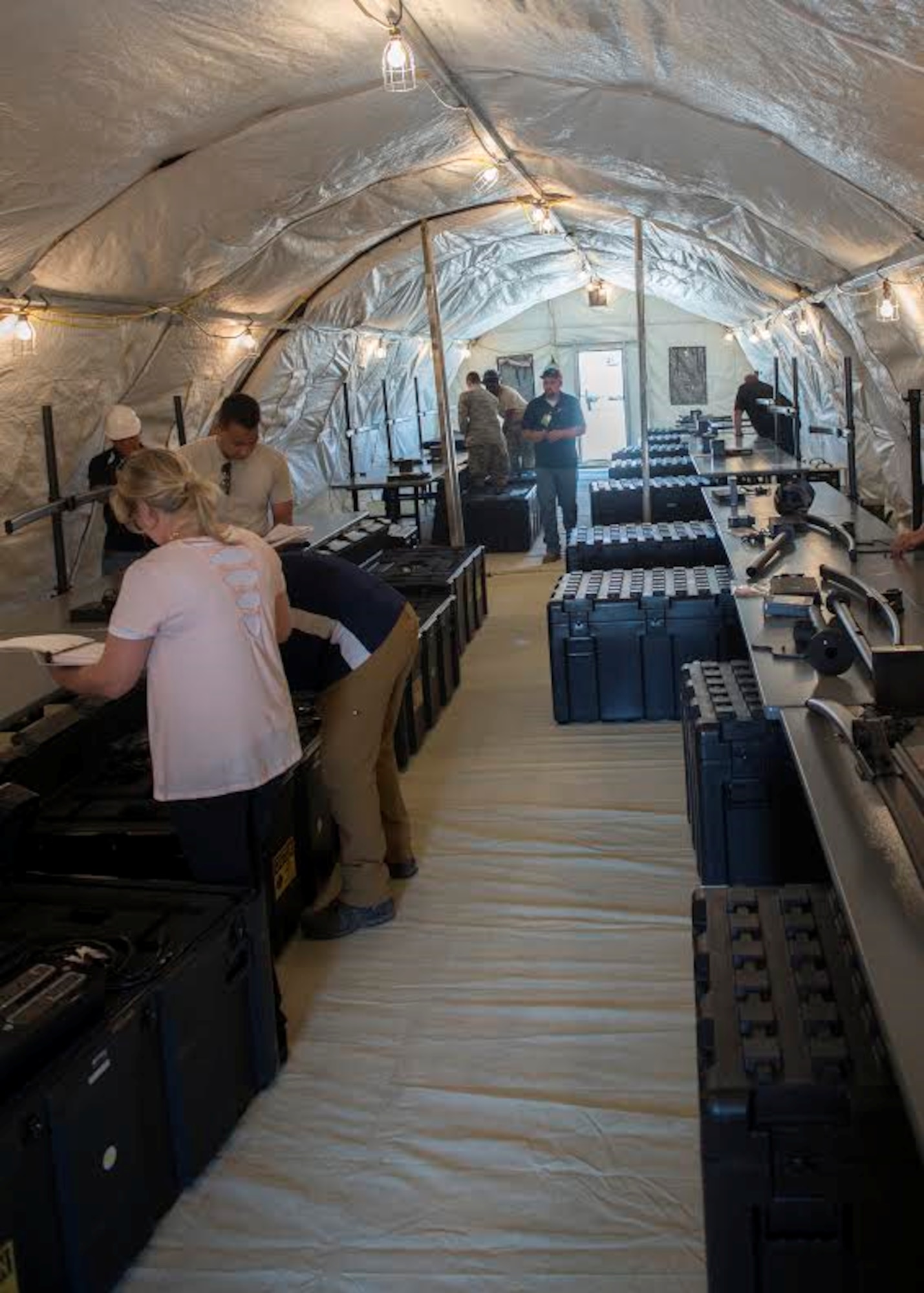 Members of the 726th Air Control Squadron assemble a Small Communications Package May 30, 2017, at Mountain Home Air Force Base, Idaho.  The inflatable system allows smaller teams to transport and employ it without relying on outside agencies. (U.S. Air Force photo by Airman 1st Class Jeremy D. Wolff/Released)