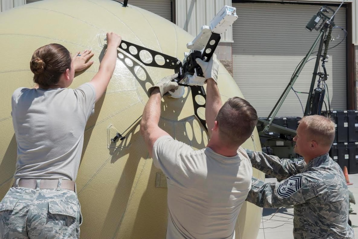 Chief Master Sergeant Mark Hurst, 552nd Air Control Wing Command Chief (Far Right) is shown how to assemble the Small Communications Package by members of the 726th Air Control Squadron May 31, 2017, at Mountain Home Air Force Base, Idaho.  The 726th is the first Air Control Squadron to test the system and report whether it is something they should continue to work with. (U.S. Air Force photo by Airman 1st Class Jeremy D. Wolff/Released)